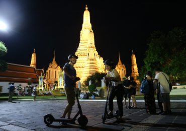 Wat Arun on an electric scooter tour